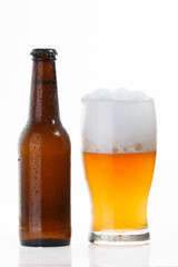 Beer bottle and glass with cold beer