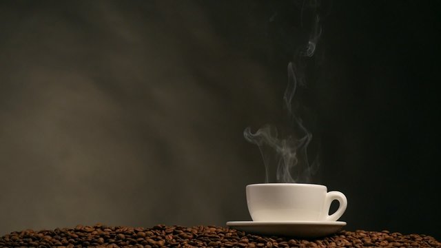 Cup of coffee on dark background