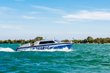 Obraz premium Police patrol motorboat during a security check in Venice, Italy