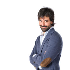 Handsome man with his arms crossed over white background