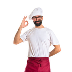 Chef making Ok sign over white background