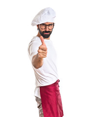 Chef with thumb up over white background