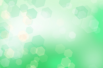 Fototapeta na wymiar Abstract green honeycomb background with bokeh effect.
