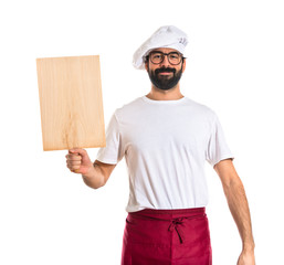 Chef holding a wood tool