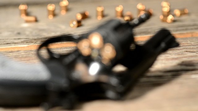 detail of revolver with cartridges ,rack focus