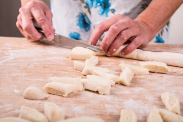 Making noodles on board from dough