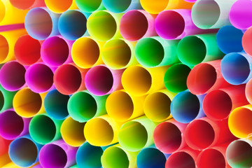 multicolored plastic drinking straws close up