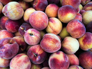 Fresh Organic Peaches Heap at the farmers Market