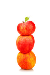 stack of red apples with green leaf