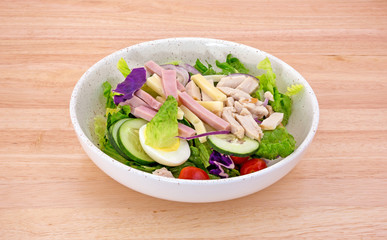 Chef salad on a wood table