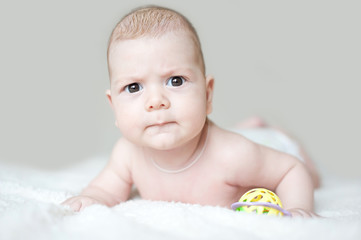 Little beautiful blue-eyed baby boy/girl