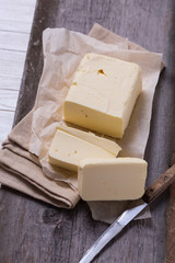 Fresh butter on wooden board.