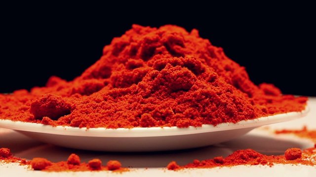 Heap of paprika powder,rotating