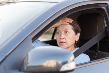frightened  woman in   car.