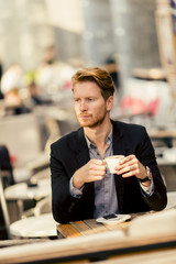 Young businessman in the cafe