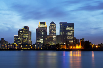 London Docklands skyline over Thames river at night