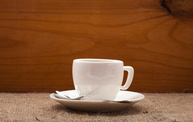 cup of coffee  on burlap tablecloth