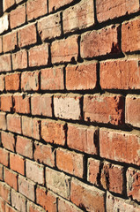 Wall made of old red bricks