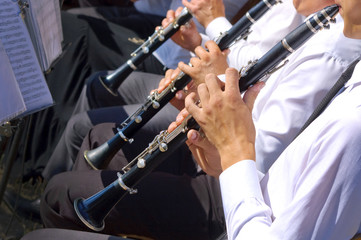 Musician playing clarinet in street orchestra