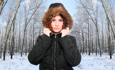 Woman dressed in warm jacket with fur hood for frosty weather.