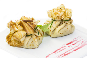 pancakes with meat on a table in a restaurant