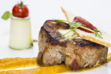 roasted meat with mustard sauce on a white background