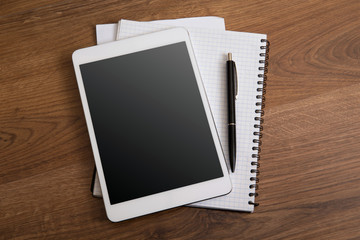digital tablet on a wooden background