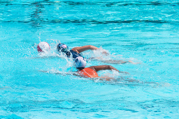 Water polo players in competition