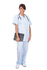 Female Nurse Holding Digital Tablet Against White Background