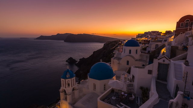 Sunset over town of Oia on the Island of Santorini, Greece