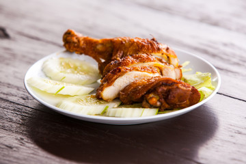 Grilled chicken on dish.