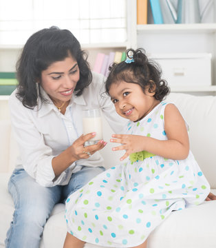 Indian Mother And Child Drinking Milk