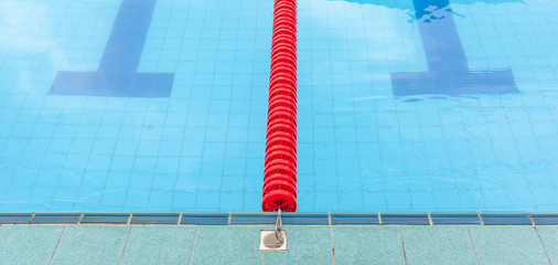 The red marked lane in center of platform for swimming competiti
