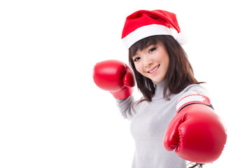 happy, smiling woman wearing christmas santa hat, boxing gloves