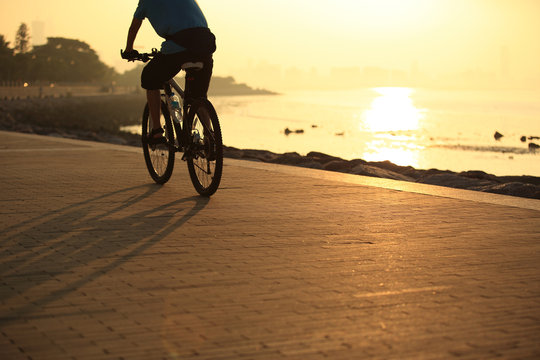cycling at sunrise seaside 