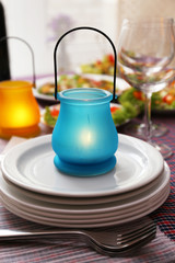 Buffet table with dishware waiting for guests