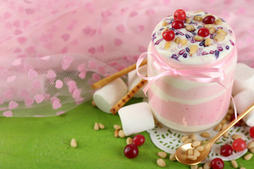 Fototapeta na wymiar Cranberry milk dessert in glass jar,