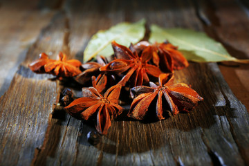 Star anise on dark wooden background, close-up