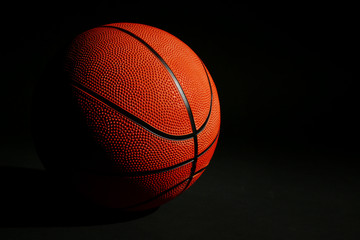 Obraz premium Basketball ball on black background