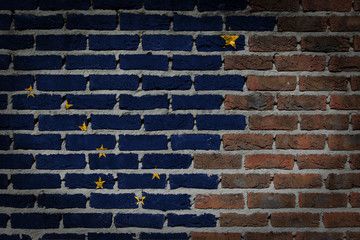 Fototapeta na wymiar Brick wall texture with flag