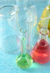 Different laboratory glassware with colorful liquid