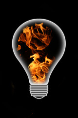 Illuminated Light Bulb Filled With Fire