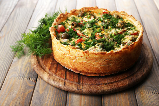 Vegetable pie with broccoli, peas, tomatoes and cheese
