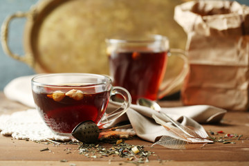 Beautiful vintage composition with herbal tea, on wooden table