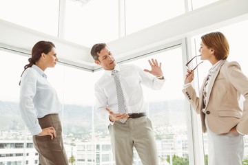 Business colleagues in discussion at office