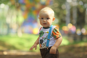 little boy in summer park