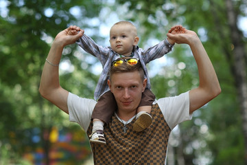 young family with a child in a summer park