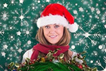 Composite image of festive blonde smiling at camera