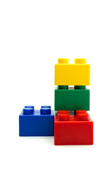 Plastic building blocks on white background