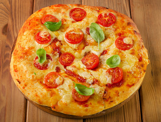 Homemade  pizza with tomatoes and cheese
